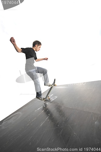 Image of Boy practicing skate in a skate park - isolated