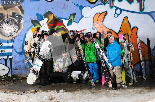 Image of Group of  skiirs standing against background