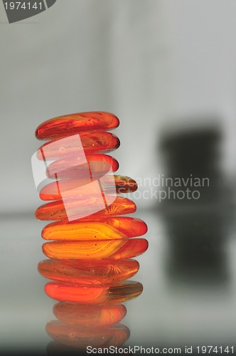 Image of isolated wet zen stones with splashing  water drops  