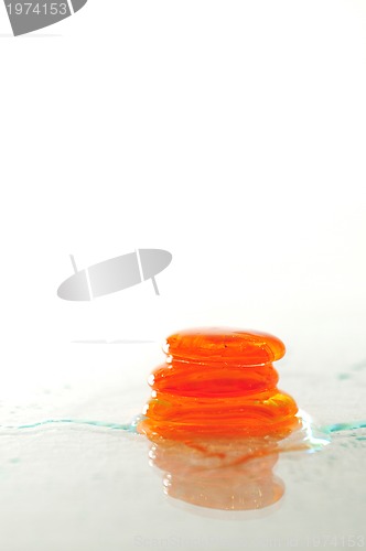 Image of isolated wet zen stones with splashing  water drops  