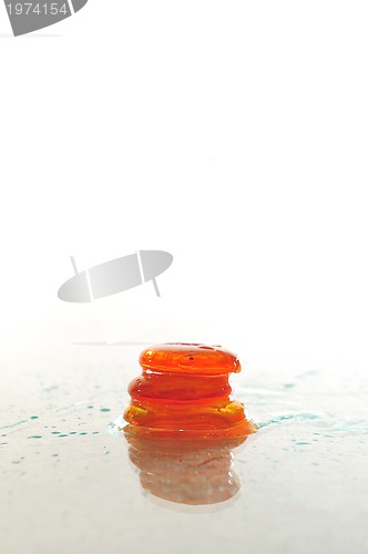 Image of isolated wet zen stones with splashing  water drops  