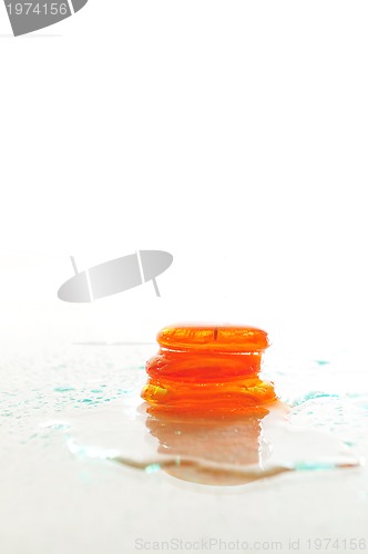 Image of isolated wet zen stones with splashing  water drops  