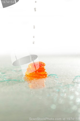 Image of isolated wet zen stones with splashing  water drops  