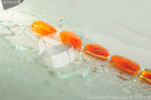 Image of isolated wet zen stones with splashing  water drops  