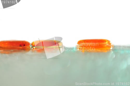 Image of isolated wet zen stones with splashing  water drops  