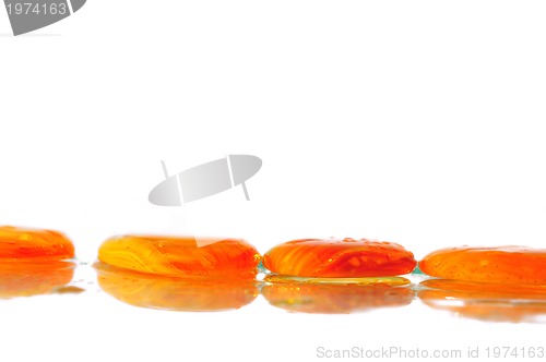 Image of isolated wet zen stones with splashing  water drops  