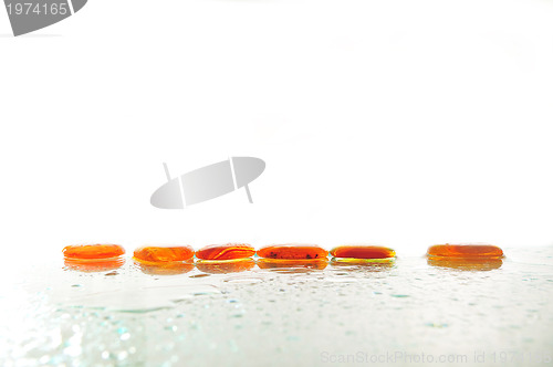 Image of isolated wet zen stones with splashing  water drops  