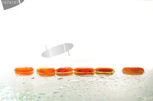 Image of isolated wet zen stones with splashing  water drops  