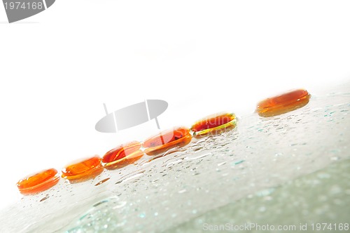 Image of isolated wet zen stones with splashing  water drops  