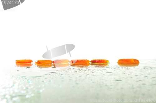 Image of isolated wet zen stones with splashing  water drops  