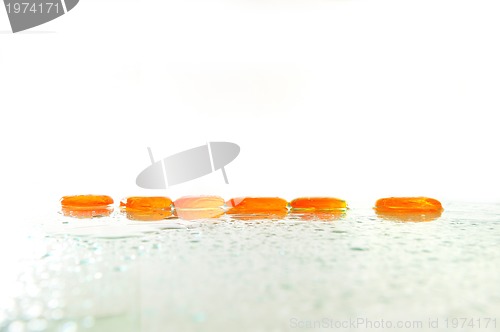 Image of isolated wet zen stones with splashing  water drops  