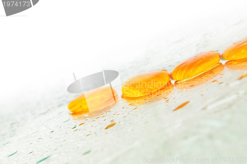 Image of isolated wet zen stones with splashing  water drops  