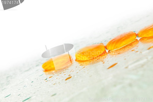 Image of isolated wet zen stones with splashing  water drops  