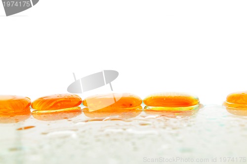 Image of isolated wet zen stones with splashing  water drops  