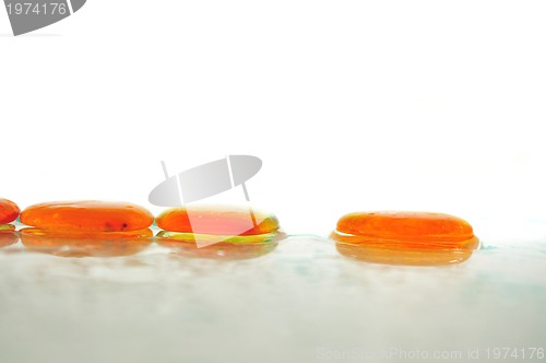 Image of isolated wet zen stones with splashing  water drops  