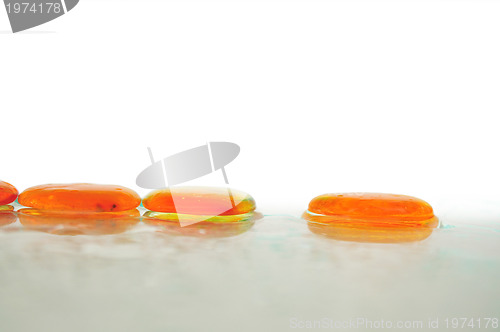 Image of isolated wet zen stones with splashing  water drops  