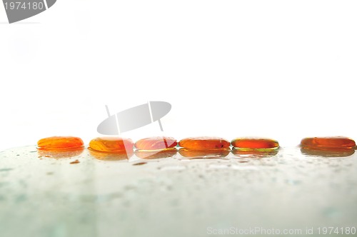 Image of isolated wet zen stones with splashing  water drops  