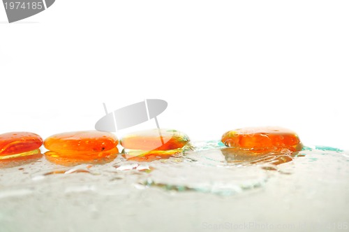 Image of isolated wet zen stones with splashing  water drops  