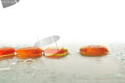 Image of isolated wet zen stones with splashing  water drops  