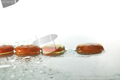 Image of isolated wet zen stones with splashing  water drops