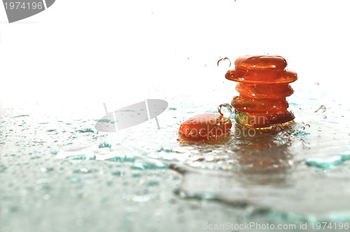 Image of isolated wet zen stones with splashing  water drops