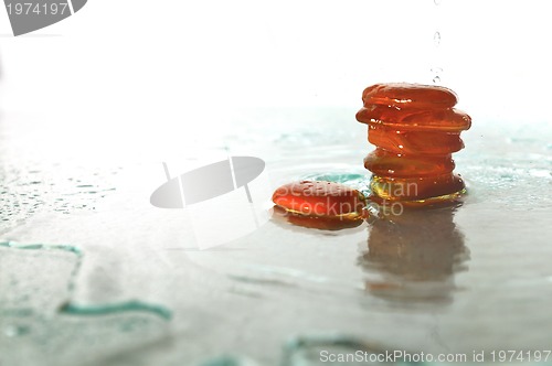 Image of isolated wet zen stones with splashing  water drops