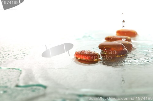 Image of isolated wet zen stones with splashing  water drops