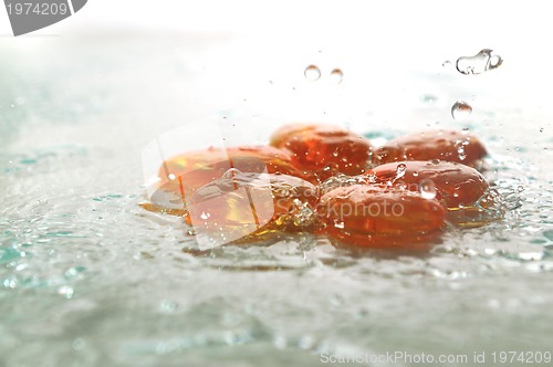 Image of isolated wet zen stones with splashing  water drops