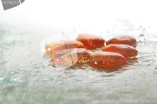 Image of isolated wet zen stones with splashing  water drops