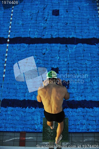 Image of young swimmmer on swimming start