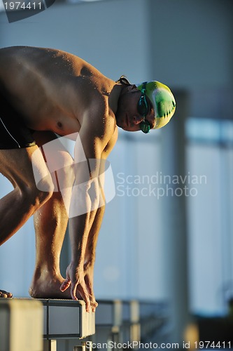 Image of young swimmmer on swimming start