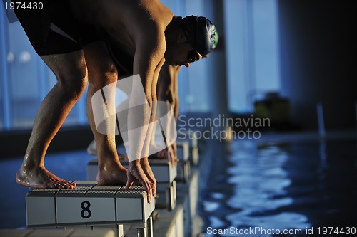 Image of young swimmmer on swimming start