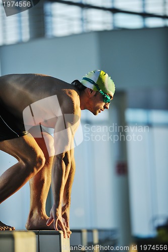 Image of young swimmmer on swimming start