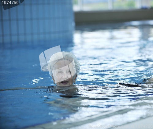 Image of senior woman at swimming pool