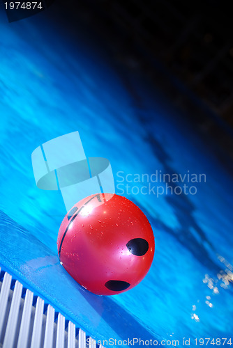 Image of .red ball in swimming pool 