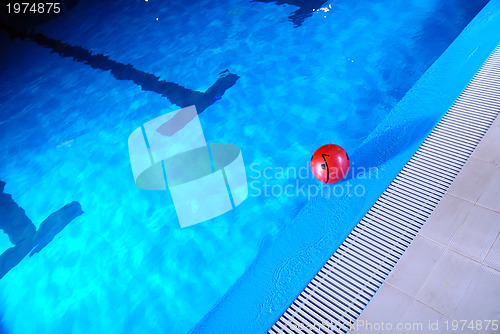 Image of .red ball in swimming pool 