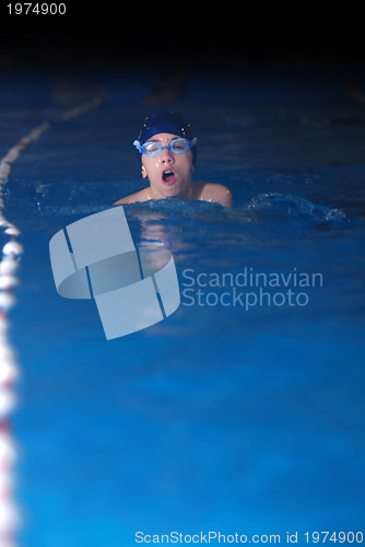 Image of .boy in swimming pool