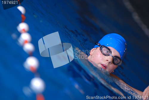 Image of .boy in swimming pool