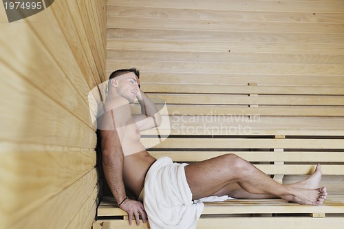 Image of attractive young man in sauna