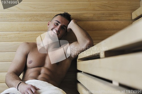 Image of attractive young man in sauna