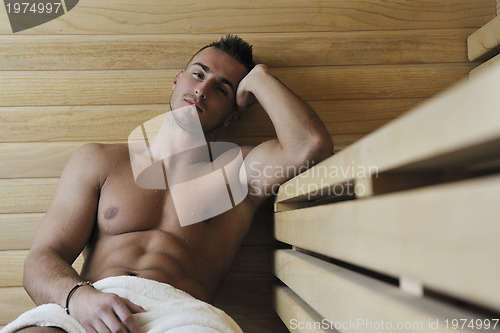 Image of attractive young man in sauna