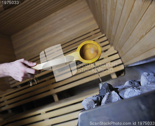 Image of hot stones and splashing water in sauna