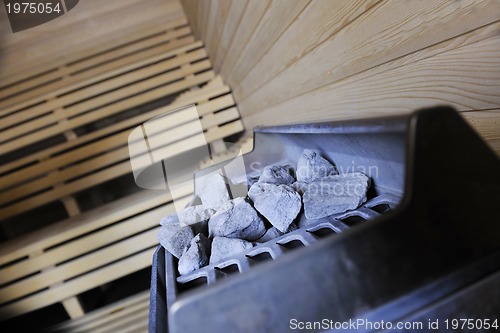 Image of hot stones and splashing water in sauna