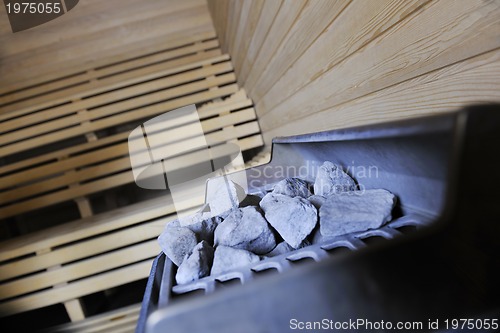 Image of hot stones and splashing water in sauna