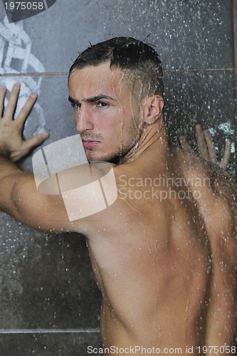 Image of good looking man under man shower