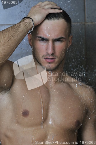 Image of good looking man under man shower