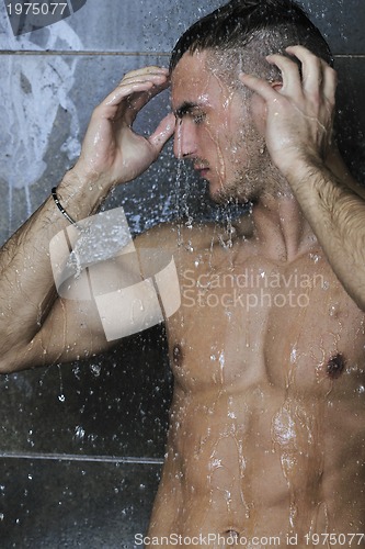 Image of good looking man under man shower