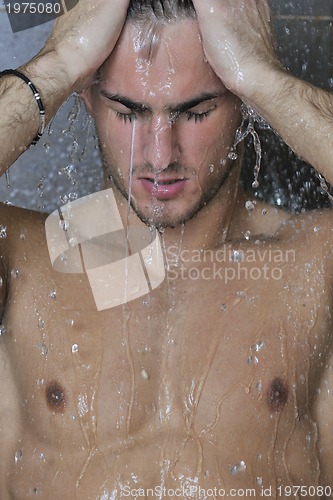 Image of good looking man under man shower