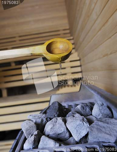 Image of hot stones and splashing water in sauna