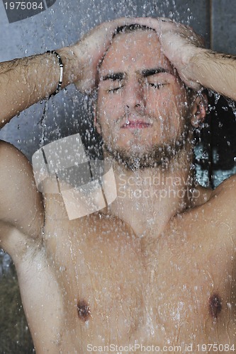 Image of good looking man under man shower